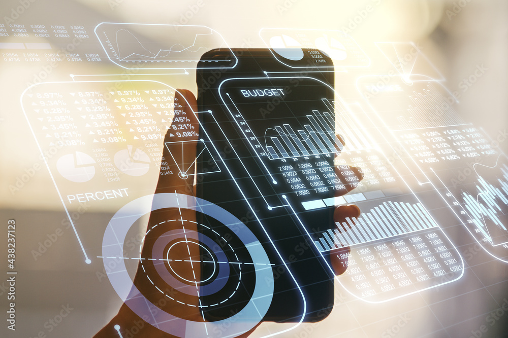 Multi exposure of abstract graphic data spreadsheet sketch and hand with mobile phone on background, analytics and analysis concept Multi exposure of abstract graphic data spreadsheet sketch and hand with mobile phone on background, analytics and analysis concept