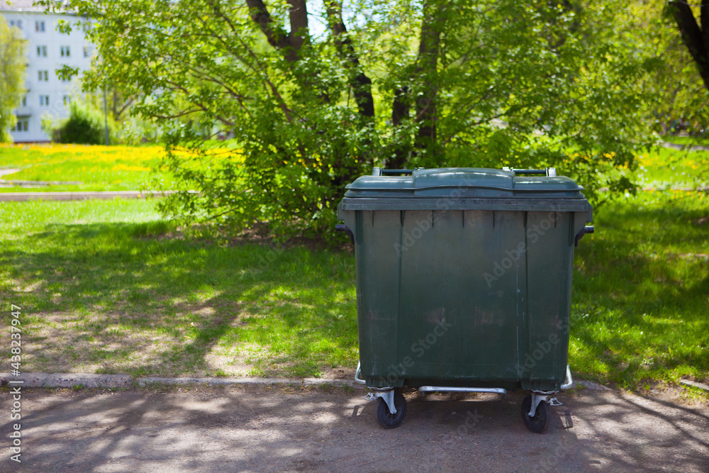 Recycle bins in the public park near the street front of tree background Recycle bins in the public park near the street front of tree background