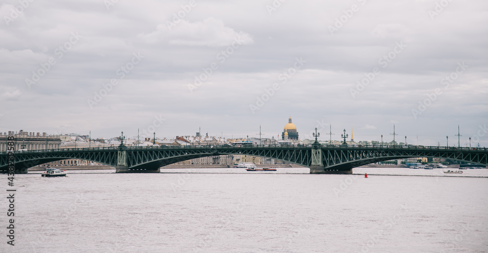 City landscape of Trinity Bridge. In the background is the dome of St. Isaac's Cathedral.