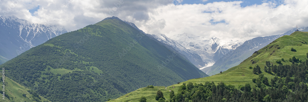 Fantastic view of mountains in North Ossetia, Alania with cloudy sky. Concept of travel the world. Russia. Wide banner