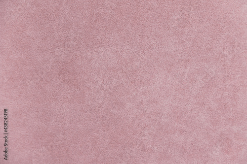 Background with pink velours texture, close-up photo