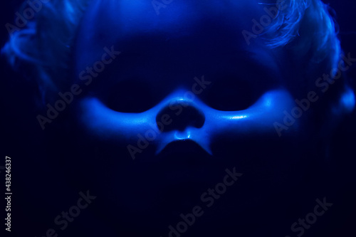 Stampa su Tela Creepy horror photo of a fashioned doll face close up with black background