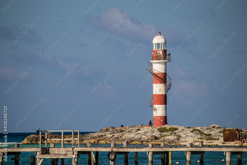 cancun lighthouse with birds, mexican caribbean