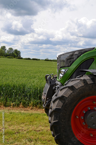 Tractor by green field