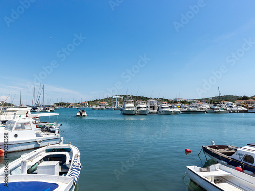 Anchored fishing boats in the port of small fishing village Jezera, located on Murter island, Croatia at the start of summer season