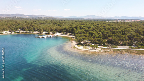 Aerial image of St. Ante walkway, located in the dense pine forest on the shore of Adriatic sea at the city of Sibenik, Croatia