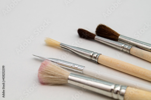 Brushes for makeup and manicure. Stylist. Beauty and fashion. Background for the designer.