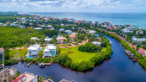 Fotografie Aerial view of waterfront homes on the bay with the Gulf of Mexico in the backgr