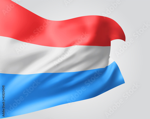 Luxembourg  vector flag with waves and bends waving in the wind on a white background.