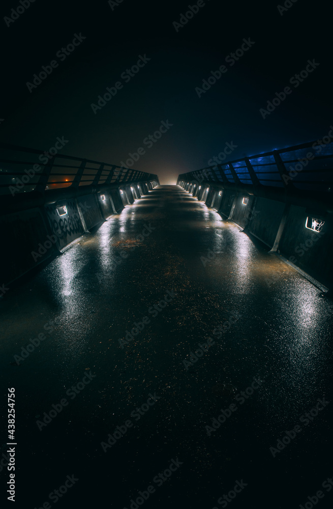 Fototapeta premium Bridge to nowhere at night with lights and reflections