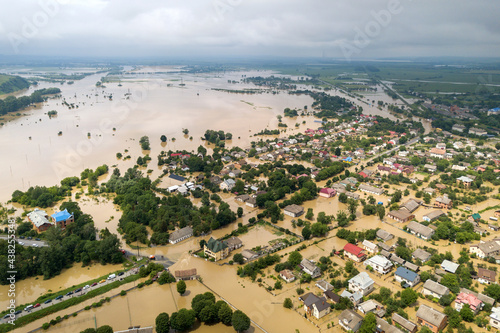 Aerial view of flooded houses with dirty water of Dnister river in Halych town, western Ukraine. photo
