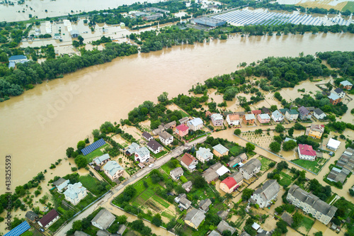 Aerial view of Dnister river with dirty water and  flooded houses in Halych town, western Ukraine. photo