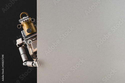 Portrait of a steampunk robot looking around the corner.