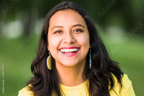 Happy latin young woman headshot with smile expression background with copy space. Bolivian South American ethnic real people face portrait photo