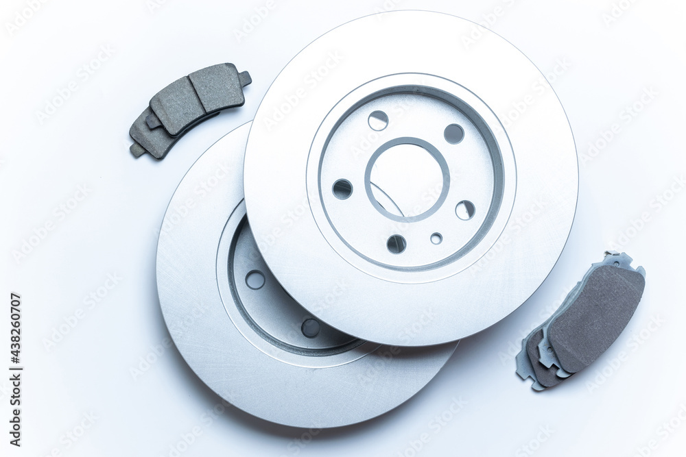 Car engine parts. Auto motor mechanic spare or automotive piece on white background. New metal car part. Flat lay, top view, copy space. Car engine parts. Auto motor mechanic spare or automotive piece on white background. New metal car part. Flat lay, top view, copy space.