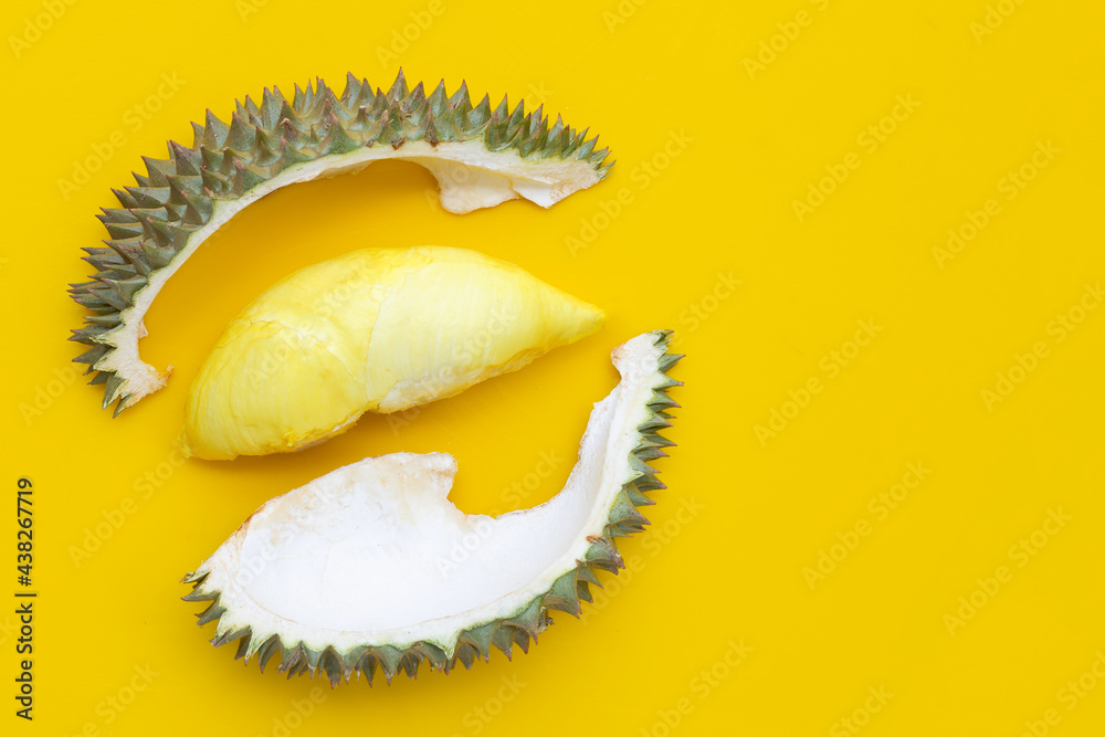 Fototapeta premium Durian on yellow background. Copy space