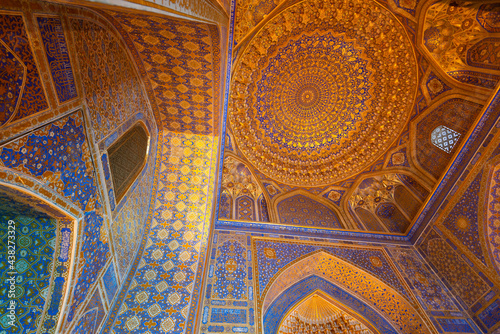 Interior of Tilya Kori Mosque and Madrasah in Registan Square. Decoration of gold applied by the kyndal method. Samarkand, Uzbekistan.
