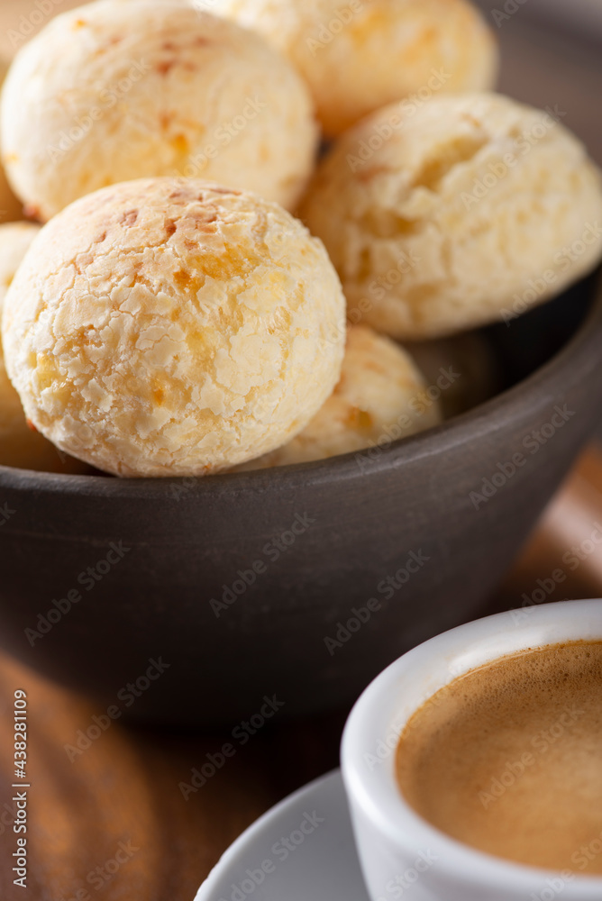 CHEESE BREAD WITH ESPRESSO COFFEE ON A WOODEN TABLE