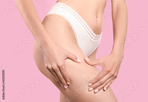 Wallpaper Mural Closeup view of slim woman in underwear on pink background. Cellulite problem concept Torontodigital.ca