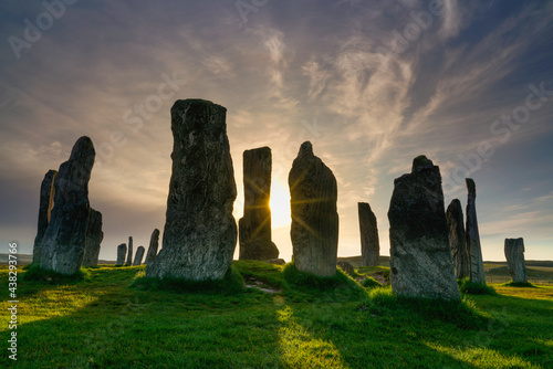 Callanish stones at sunset with sunburst and shadows. located in on the isle of Lewis, Outer Hebrides, Scotland.