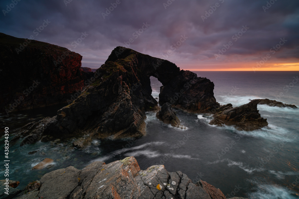 Stac A Phris sea stack arch at sunset, located on the isle of Lewis, Outer Hebrides, Scotland. Stac A Phris sea stack arch at sunset, located on the isle of Lewis, Outer Hebrides, Scotland.