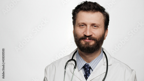 Portrait of smiling doctor on white background