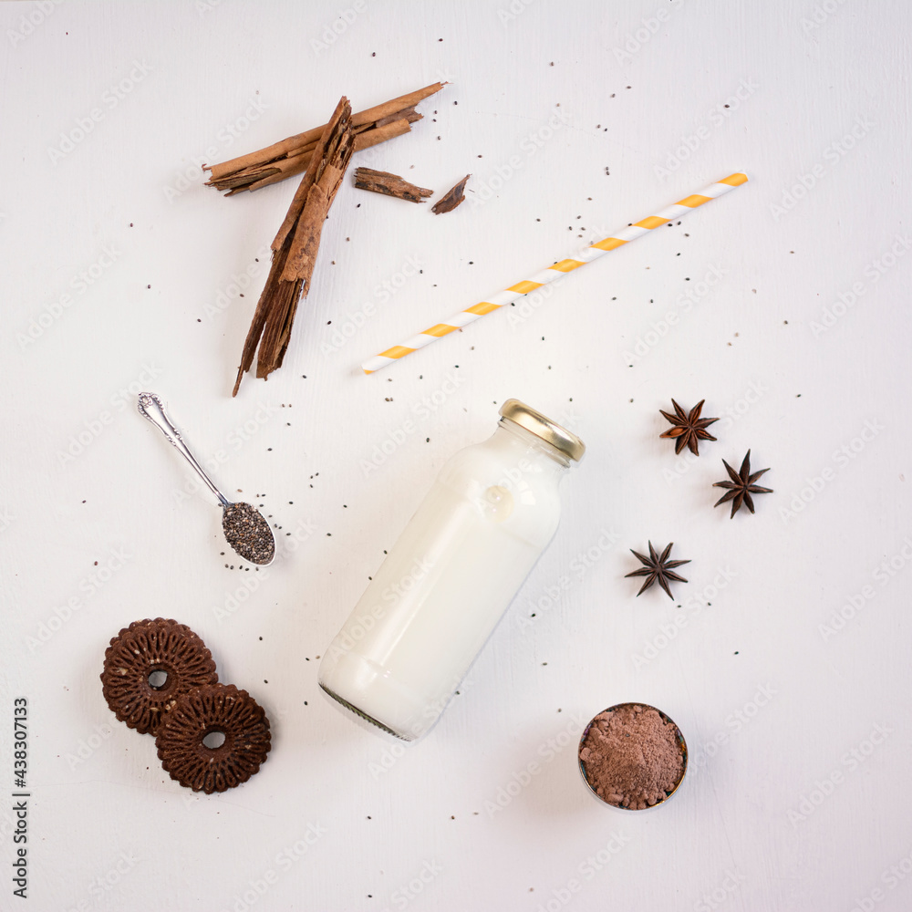 Almond milk bottle, top view. Lactose free dairy products, lactose free nut and grain milk, healthy food.