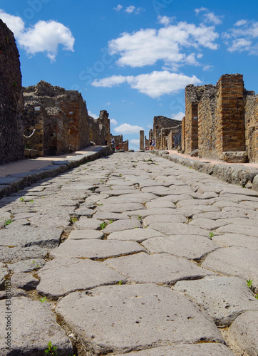 Famous landmark of ancient and historic city temple ruins with columns and walls on archeologic site museum Pompeji Pompeii excavation site in Italy near Naples and Vesuv Volcano photo