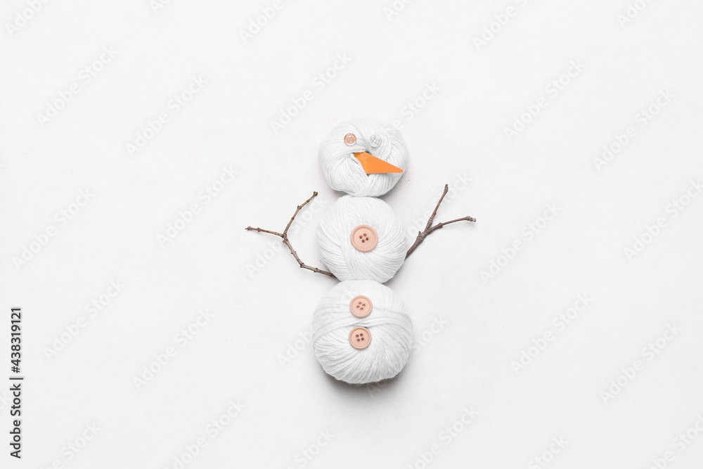 Funny snowman made of threads on white background Funny snowman made of threads on white background