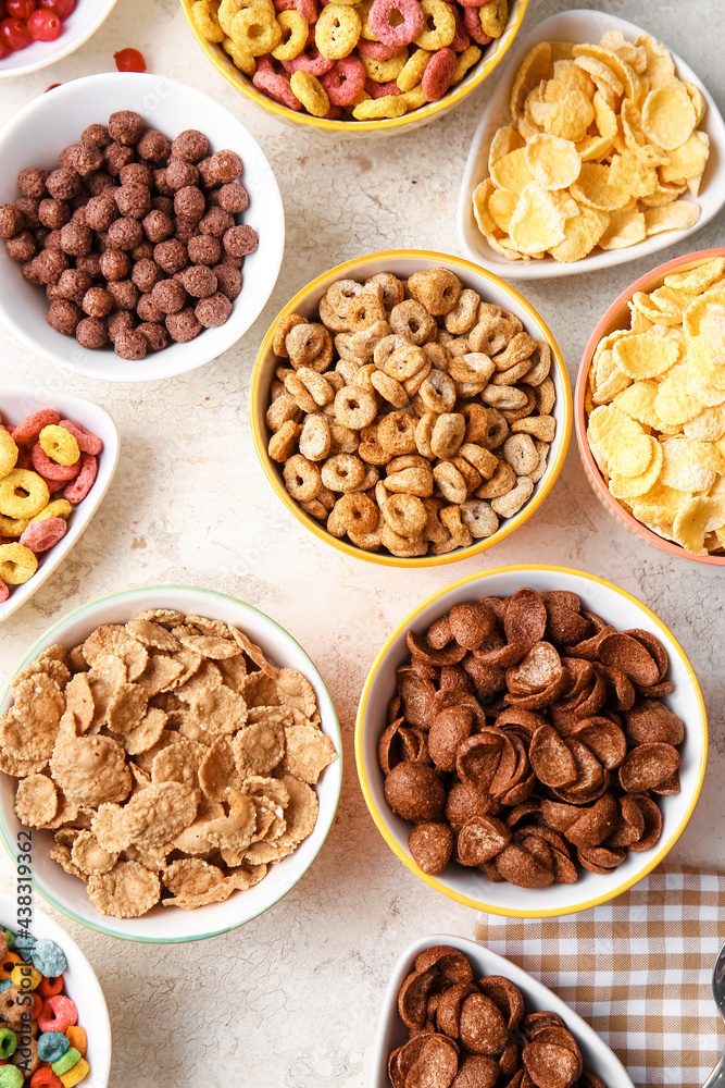 Bowls with different cereals on light background Bowls with different cereals on light background