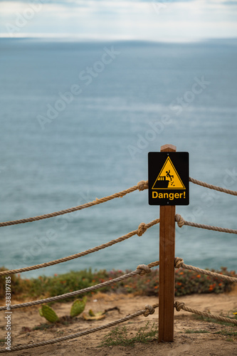 Sandstone Cliff with Danger Sign at La Jolla Shores, California, Located in San Diego County.