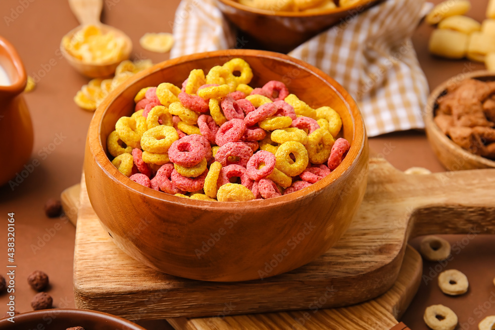 Bowl with tasty cereal rings on color background, closeup Bowl with tasty cereal rings on color background, closeup