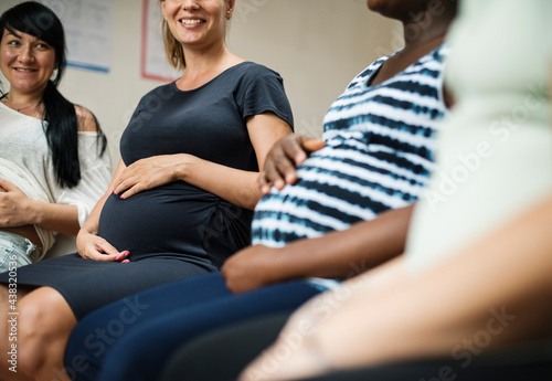 Pregnant women in a class photo