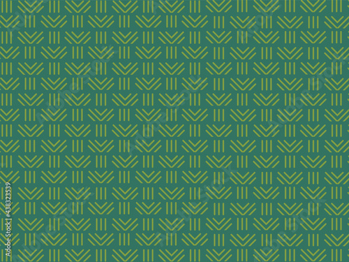 Repition style yellow ornamental design on green background. 