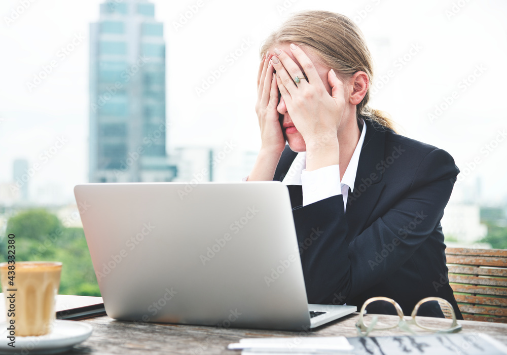 Stressed woman working on her laptop Stressed woman working on her laptop