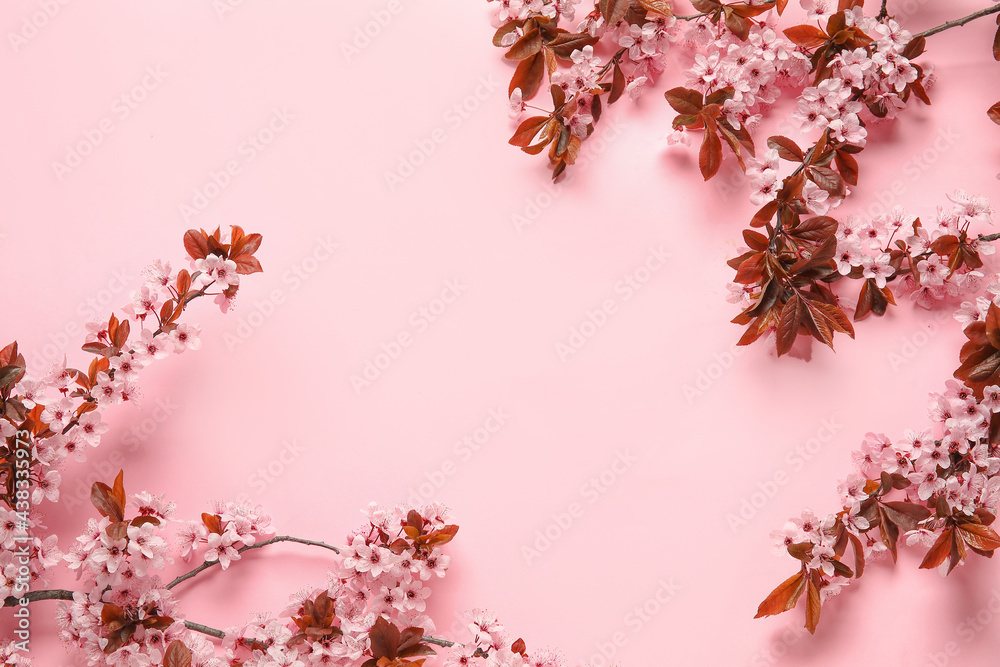 Beautiful blossoming branches on color background