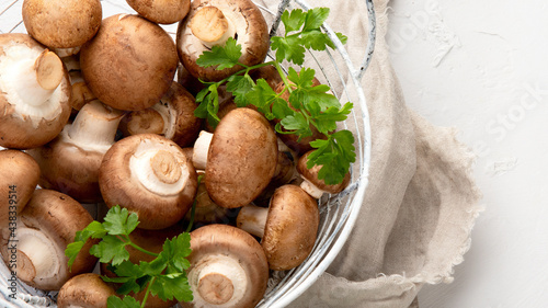 Champinion mushrooms on light background. Vegan food concept.