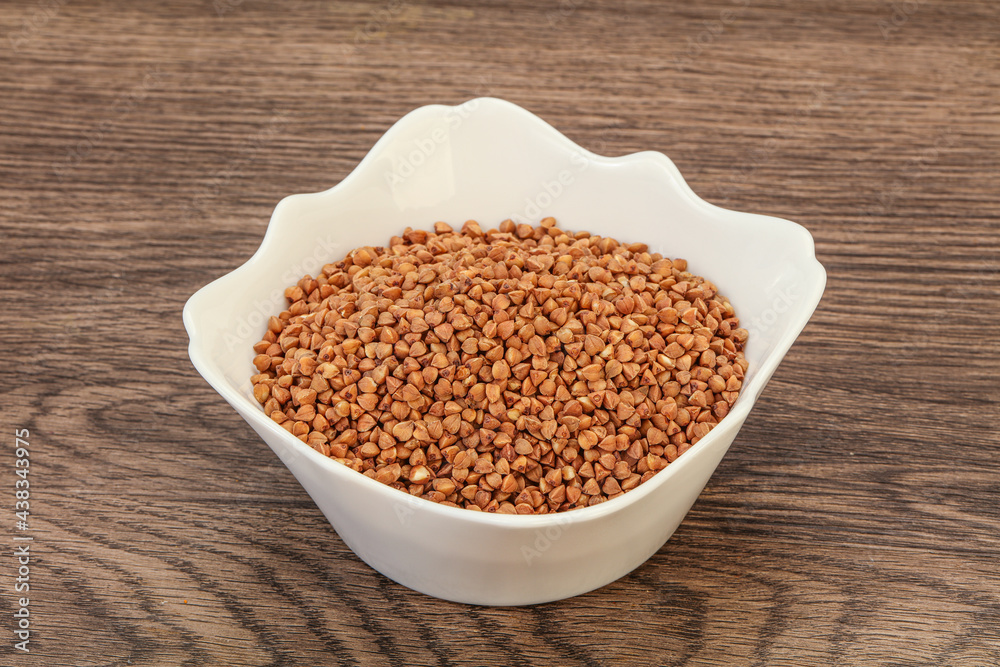 Raw buсkwheat cereal in the bowl Raw buсkwheat cereal in the bowl