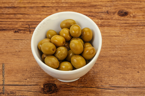 Green pickled olives in the bowl