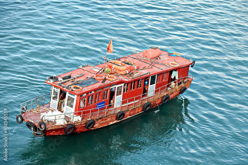 Seagoing vessels, barges, tugboats and small boats at the roadstead of Halong bay under cargo operations and underway. Port of Campha, China. Vietnam, October, 2020 photo