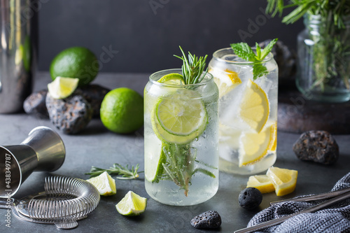 Hard seltzer cocktails with lime and lemon and bartenders accessories