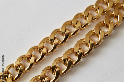 gold chain on a light background close-up, wealth luxury