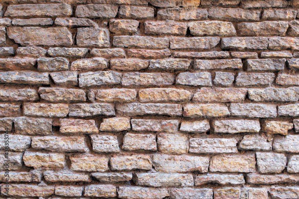 Fototapeta premium Old brick and stone wall as background