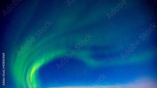 Background banner colorful arctic polar night starry sky with aurora borealis and Northern Lights in forest