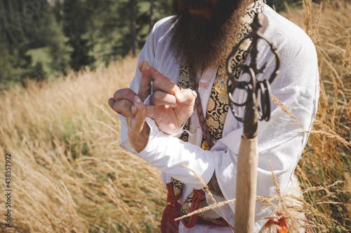 European Shugendo monk in traditional outfit hiking in the Austrian mountains, Austrian, Ötscher photo