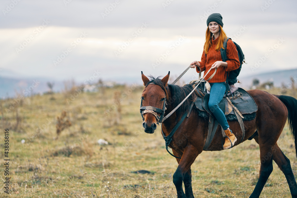 Fototapeta premium woman hiker riding horse travel mountains landscape