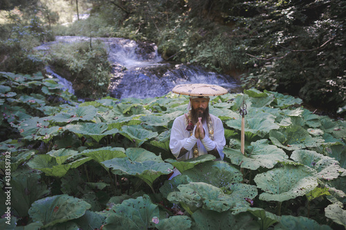 European Shugendo monk in traditional outfit hiking in the Austrian mountains, Austrian, Ötscher photo