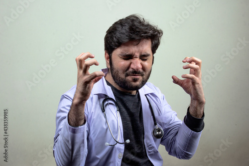 A doctor with intense frustrating expressions gestures