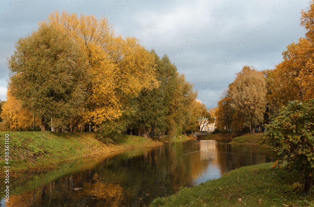 russia, park, St. petersburg, pond among autumn trees with orange foliage russia, park, St. petersburg, pond among autumn trees with orange foliage