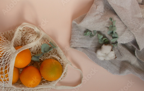 Eco friendly lifestyle concept. Oranges in an eco-friendly string bag